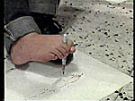 A boy in Adir's class drawing by foot 